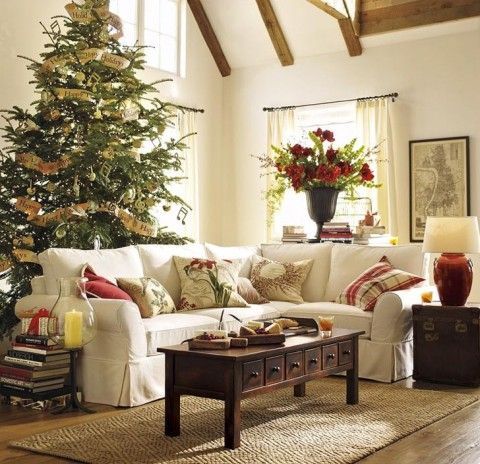Tree behind sofa How to Arrange your Living Room Around your Christmas Tree