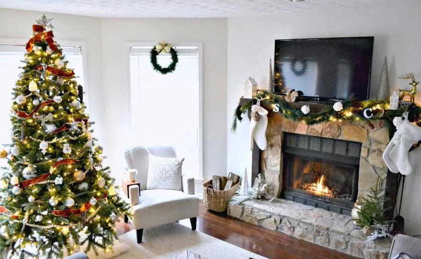 Tree beside fire place How to Arrange your Living Room around your Christmas Tree