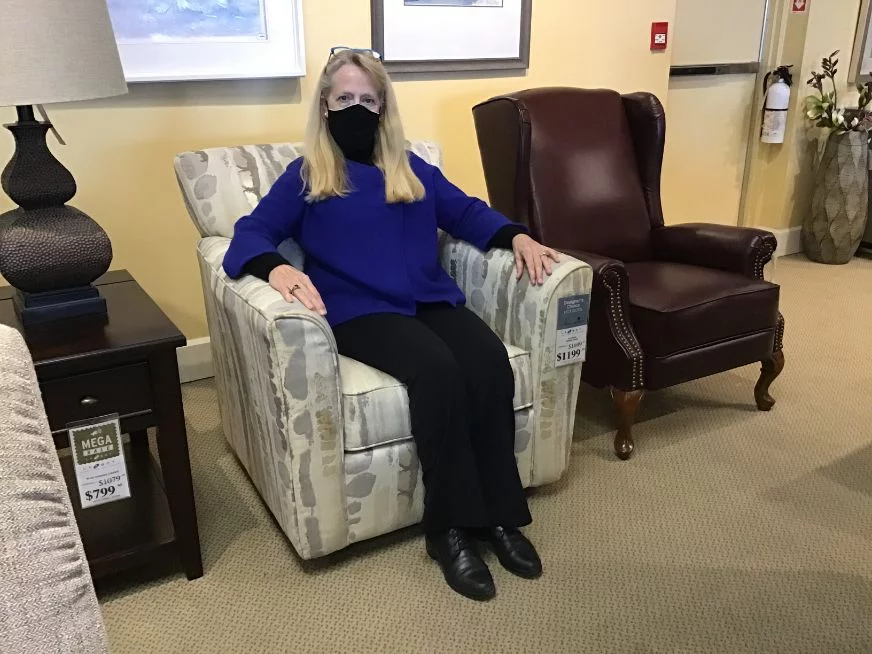 Mary Lee sitting in the Allegra Chair Review of the Reegan Swivel Chair
